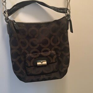 Used Coach purse. Medium black with long and short straps. Good condition
